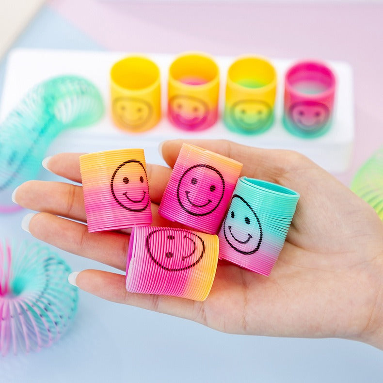 Pack Of 2 - Mini Smiling Face Rainbow Circle Spring Toy