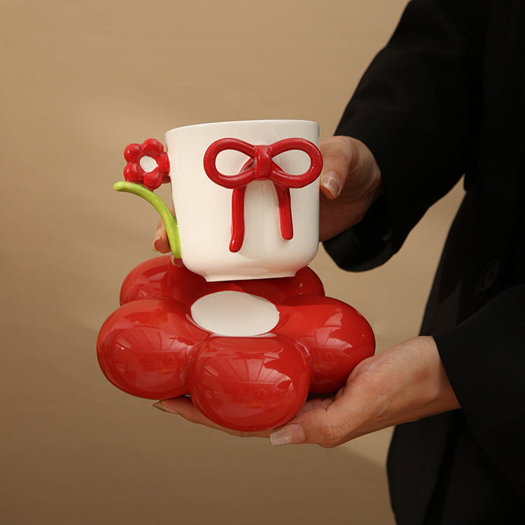 Creative Ceramic Bow Cup with Flower Sausar