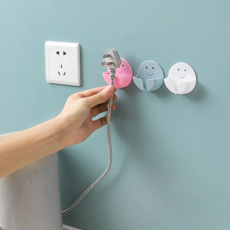 Pack Of 2 Smiley Plastic Adhesive Power Plug Wall Holder.